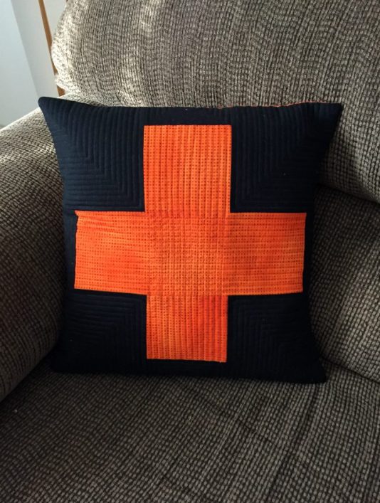 orange black plus sign pillow