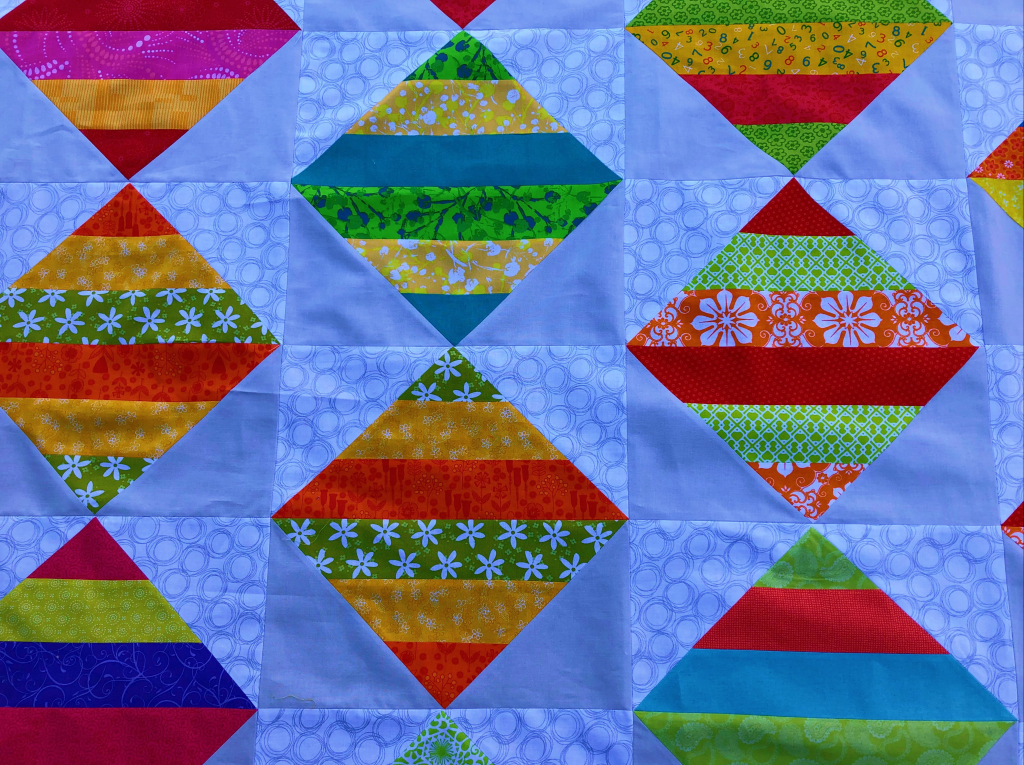 pieced flying geese quilt