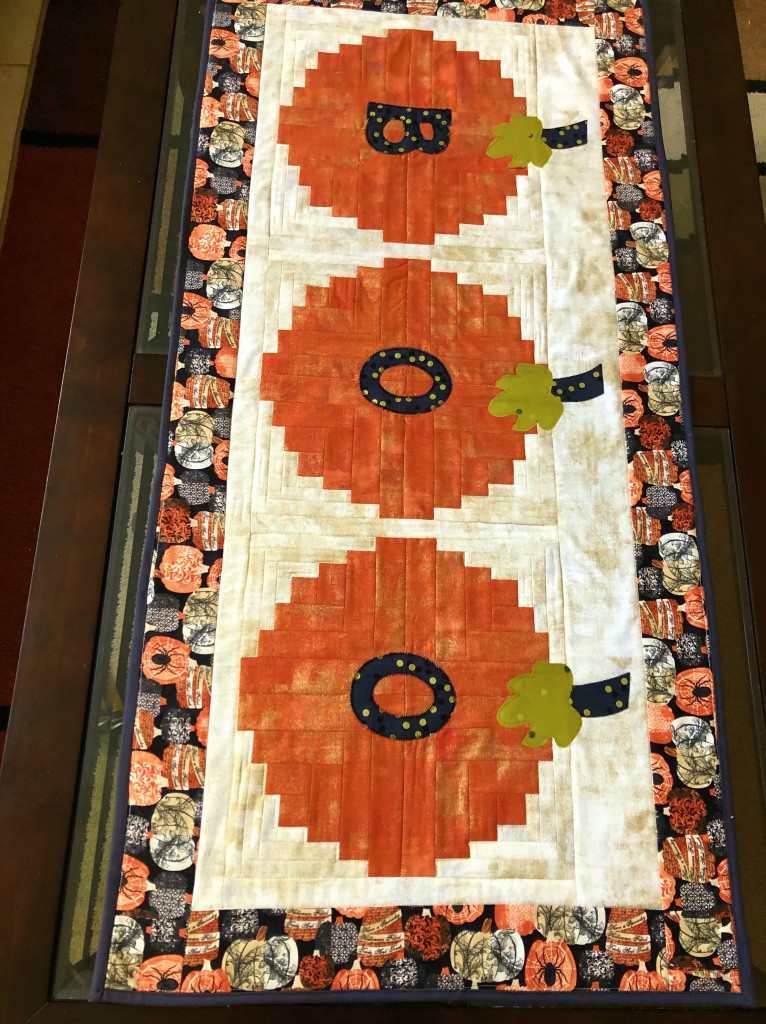 Curvy log cabin table runner Halloween